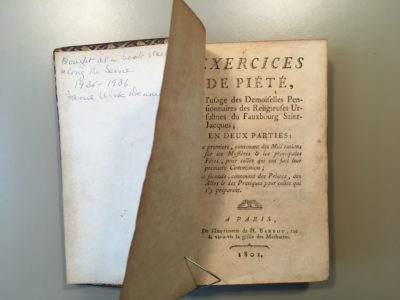 Old book showing inscription inside front cover